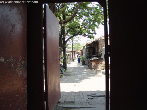 An ancient Hutong Alley with small Greenhouses ...